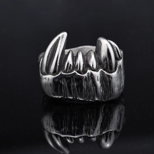 Macro shot of gothic fangs ring in vintage silver finish with punk rock textures