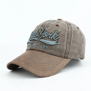 Close-up of vintage New York athletic embroidery on a two-tone cotton baseball cap