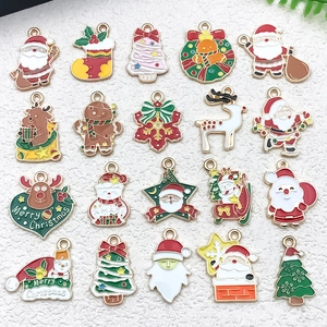 Detail of colorful enamel Christmas charms including Santa, Reindeer, and Tree for DIY jewelry