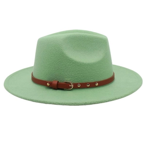 Close-up of light green wool fedora hat featuring a brown leather band and gold buckle