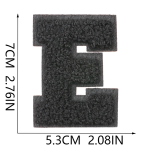 Close-up detail showing dimensions 7cm by 5.3cm of the black chenille letter E patch