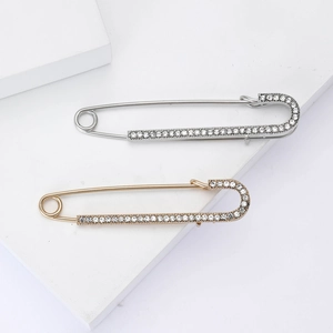 Classic gold and silver safety pins with rhinestones for suits and coats