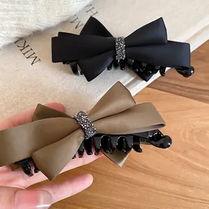 Elegant satin bow hair claw clip with rhinestones in black and olive green colors