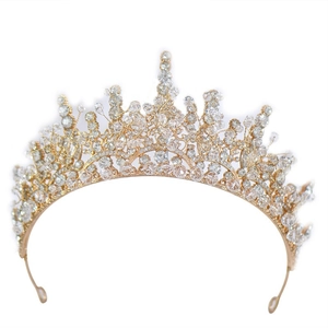 Elegant gold bridal crown featuring intricate sparkling crystal leaf patterns on a white base