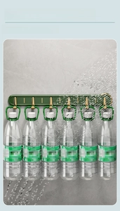Detail showing strong load-bearing wall hooks with six sturdy green and gold hangers