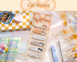 Close-up of cute cat illustration index tabs with 180 pieces on a warm desktop setting