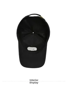Interior view of black oversized baseball cap showing stitching and logo details