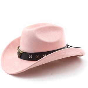 Detailed view of pink suede cowboy hat featuring vintage bull head metal ornament