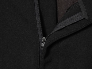 Close-up of high-quality black fabric featuring a durable hidden metal zipper closure