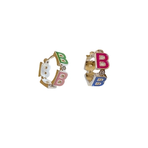 Golden hoop earrings featuring colorful enamel B letters and sparkling zircon stones