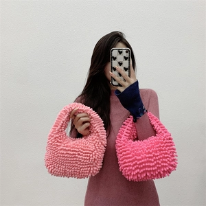 Detail of plush mop-textured tote bags in soft pink and vibrant rose pink colors