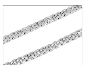 Close-up of silver Cuban link chain necklace in polished stainless steel texture