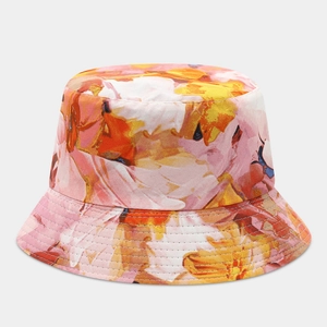 Detail of artistic floral pattern and reinforced stitching on reversible sun hat