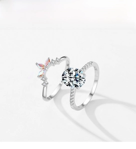 Detailed shot of S925 silver rings with zircon main stone and butterfly accent