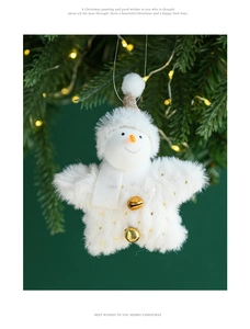 Christmas snowman plush ornament with golden bell hanging on a festive tree branch