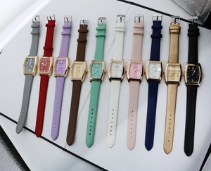 Collection of ten vintage rectangular watches with colorful leather straps and diamond accents