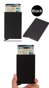 Detail view of slim black RFID metal card holder with automatic pop-up mechanism