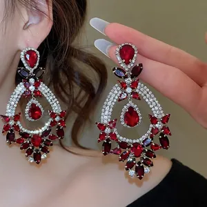 Elegant baroque drop earrings with red crystal teardrops and sparkling rhinestones