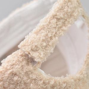 Detail shot of lamb wool baseball cap back strap with soft faux fur texture