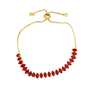 Detail of adjustable gold slide bracelet with red marquise-cut marquise stones