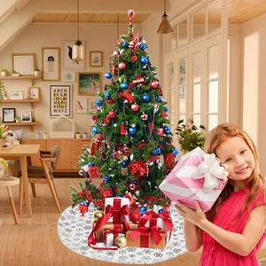 White faux fur Christmas tree skirt with golden snowflake patterns and gift boxes