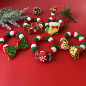 Christmas pet collar set with reindeer and bowknot motifs on a festive red background