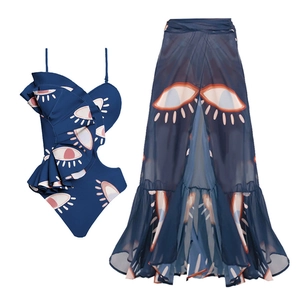 Deep blue one-shoulder ruffle swimsuit and matching chiffon skirt with eye pattern