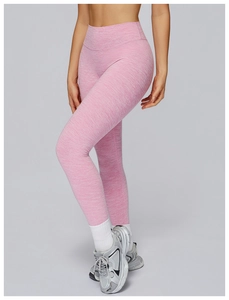 Side view of heathered pink high-waisted yoga pants with seamless compression fabric
