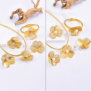 Exaggerated golden wired flower jewelry set with pearls and zircon in polished finish