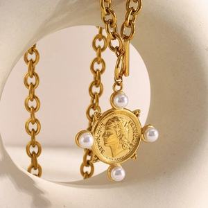 Detail of 18K gold-plated O-chain necklace with a French Republic coin and pearl pendant