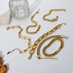 Detail showing 18K gold-plated stainless steel chain bracelets with various link styles