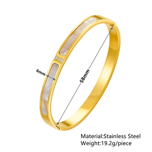 Rose gold stainless steel bangle featuring shell inlay and three centered zircon stones