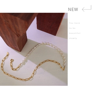 Detailed shot of 18K gold plated chain and freshwater pearls with a K18 engraved tag