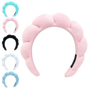Pink terry cloth twisted headband for women shown in multiple colors and high-top design