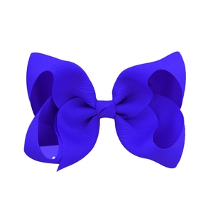 Detailed view of a blue 4-inch handmade grosgrain ribbon bow with professional stitching