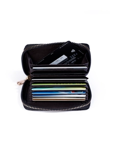 Detail view of the accordion card holder with 11 slots and smooth golden metal zipper