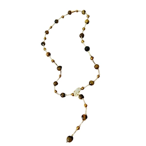 Long tassel necklace with tiger eye beads and pavé-set zircon oval pendant in gold tone