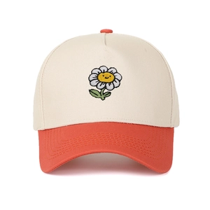 Detail of sunflower smile embroidery on a two-tone five-panel cotton baseball cap