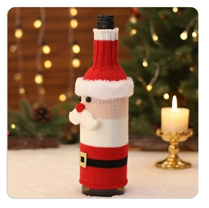 Detail of knitted Santa Claus wine bottle cover in festive holiday table setting