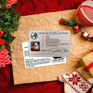 Detailed view of Santa Claus sleigh flying license card with festive Christmas background