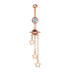 Detail of rose gold belly ring featuring planet pendant and star charms with clear zircon
