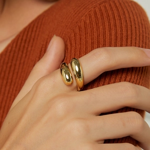 Minimalist gold teardrop open ring with a polished liquid metal finish for women