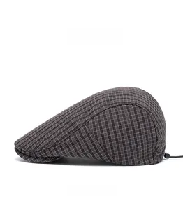 Side view of vintage plaid flat cap featuring dark grey check and adjustable back strap