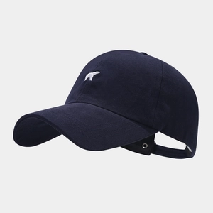 Detail view of navy blue cotton baseball cap featuring polar bear embroidery and curved brim
