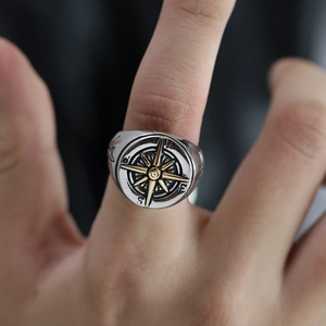 Retro stainless steel compass ring for men featuring silver finish and gold starburst design