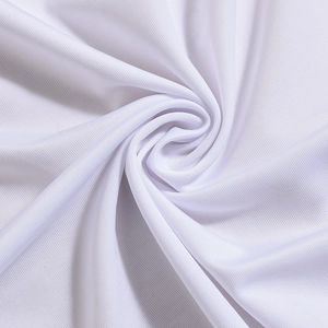 Detailed macro view of white swimwear fabric with soft knitted texture and ribbed patterns