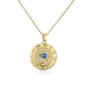 Macro shot of 18K gold plated necklace with blue enamel Eye of Horus zircon pendant