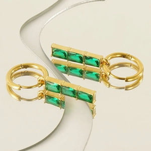 Golden titanium steel earrings featuring three rectangle green zircons on mirror reflection