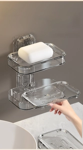 Detail of wall-mounted double-layer transparent soap box with removable drainage tray