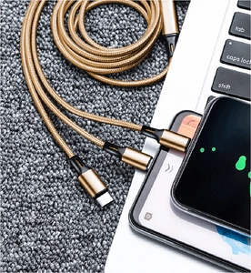 Close-up of golden nylon braided 3-in-1 charging cable with Type-C and multi-connectors